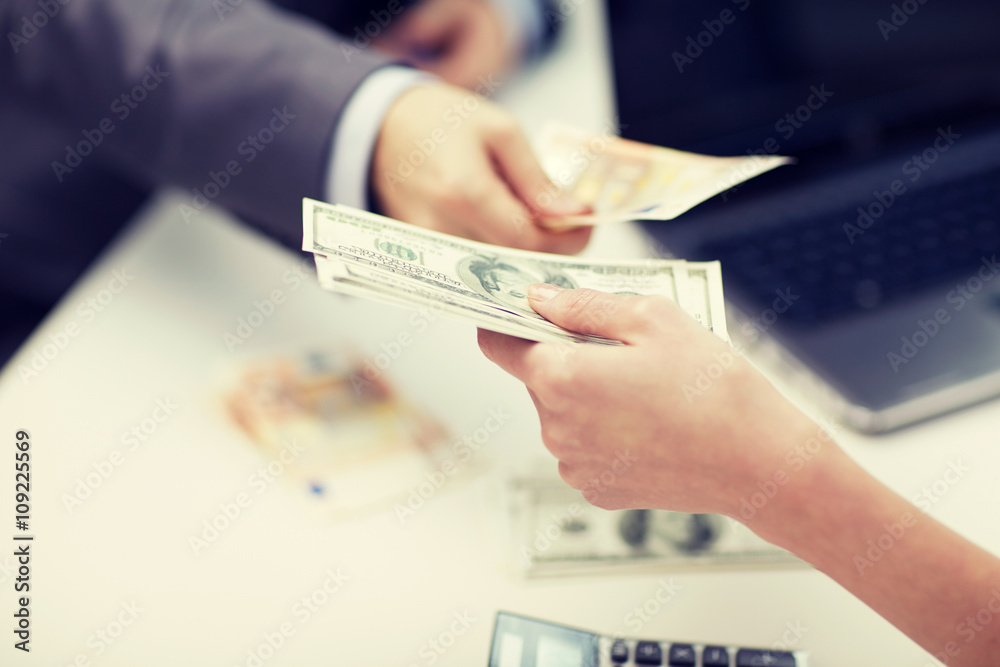 close up of hands giving or exchanging money close up of hands giving or exchanging money