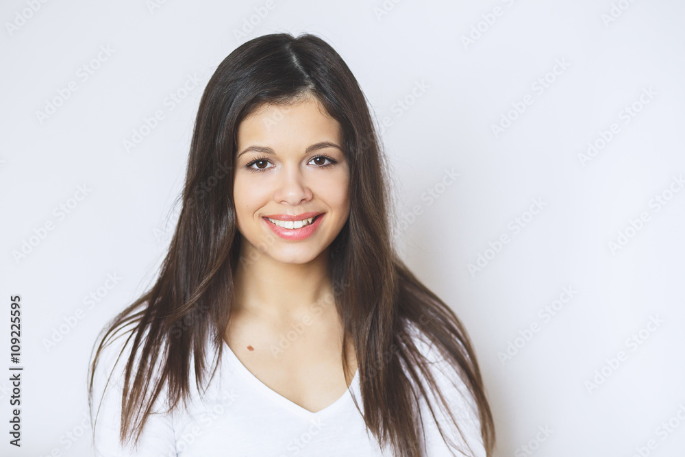 Beautiful woman smiling. Young Female touching Her Skin. Portrait on White Background. Perfect Skin. Beauty Face. Beautiful woman smiling. Young Female touching Her Skin. Portrait on White Background. Perfect Skin. Beauty Face.