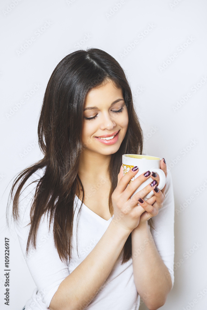 young pretty woman drinking coffee or tea . Relaxing girl . Woman drinking coffee in the morning at home lifestyle. young pretty woman drinking coffee or tea . Relaxing girl . Woman drinking coffee in the morning at home lifestyle.