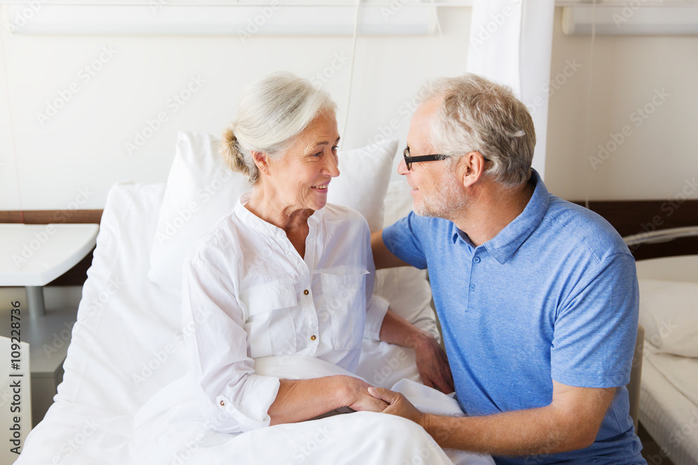 senior couple meeting at hospital ward