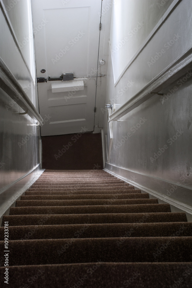 Steep holland stairway with the white door Steep holland stairway with the white door