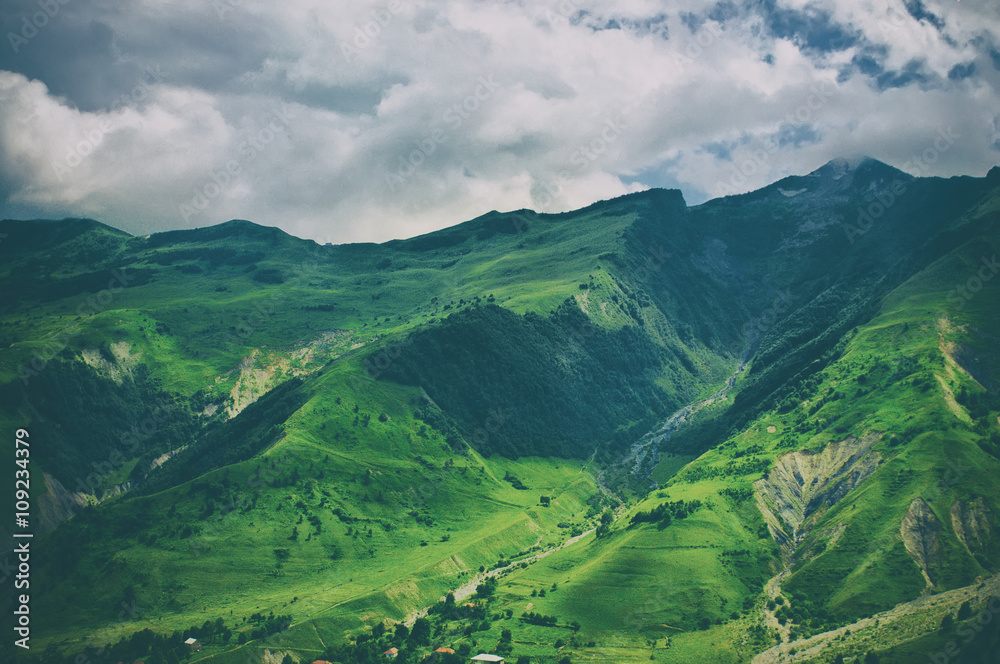 Green caucasus  mountain landscape in Georgia, natural travel vintage hipster vacation background