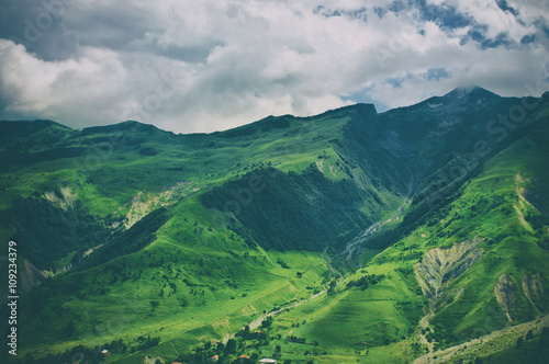 Green caucasus mountain landscape in Georgia, natural travel vintage hipster vacation background © Roxana
