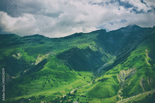 Green caucasus mountain landscape in Georgia, natural travel vintage hipster vacation background