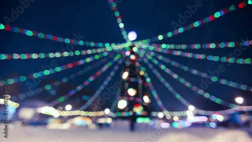 Rotating Illuminated christmas tree outdoor blurred photo