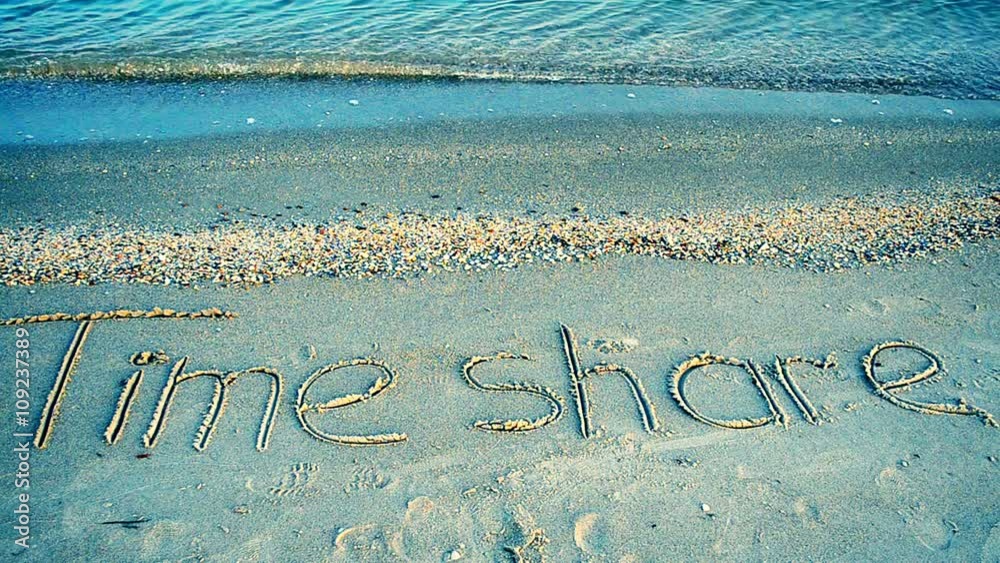The inscription time share on sand, the beach.