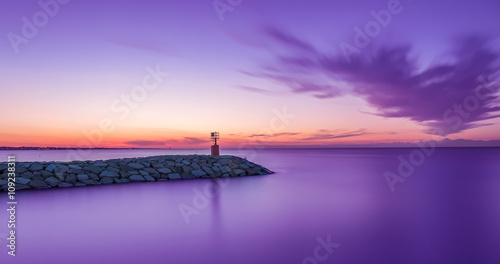 seascape sunset with purple sky and sea. Long exposure