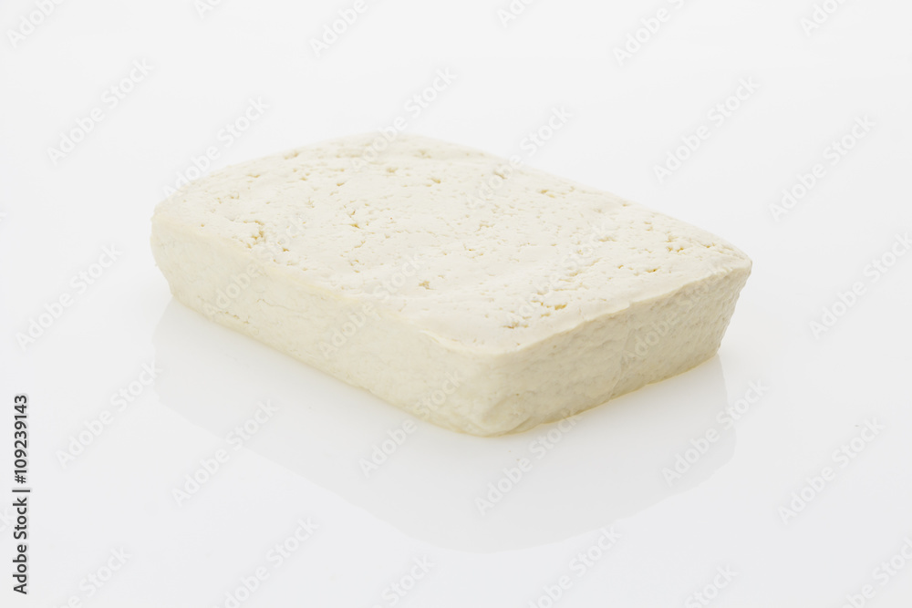 Tofu block, isolated on white background.