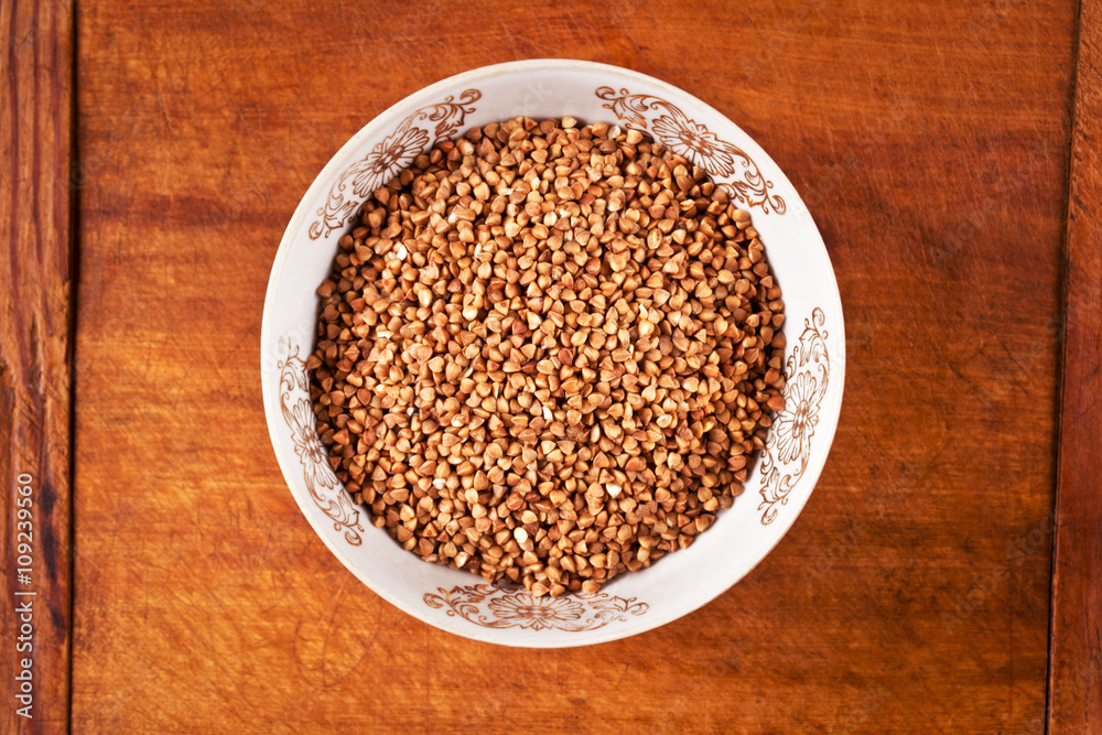 High iron buckwheat in a bowl on a wooden table High iron buckwheat in a bowl on a wooden table