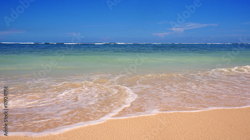 Fototapeta Naklejka Na Ścianę i Meble -  Pendawa Beach,Bali,Indonesia,With Waves And Empty Beach Sands.Travel and spa concept photo.