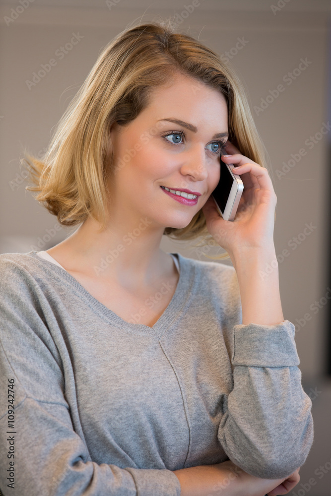 Beautiful girl using her mobile phone in cafe. Beautiful girl using her mobile phone in cafe.