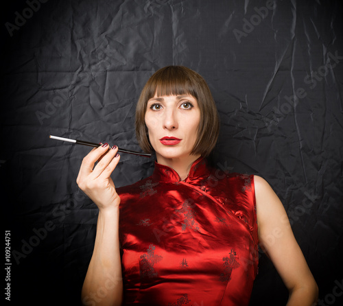 woman with a cigarette holder