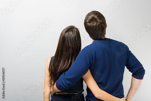  young couple standing back
