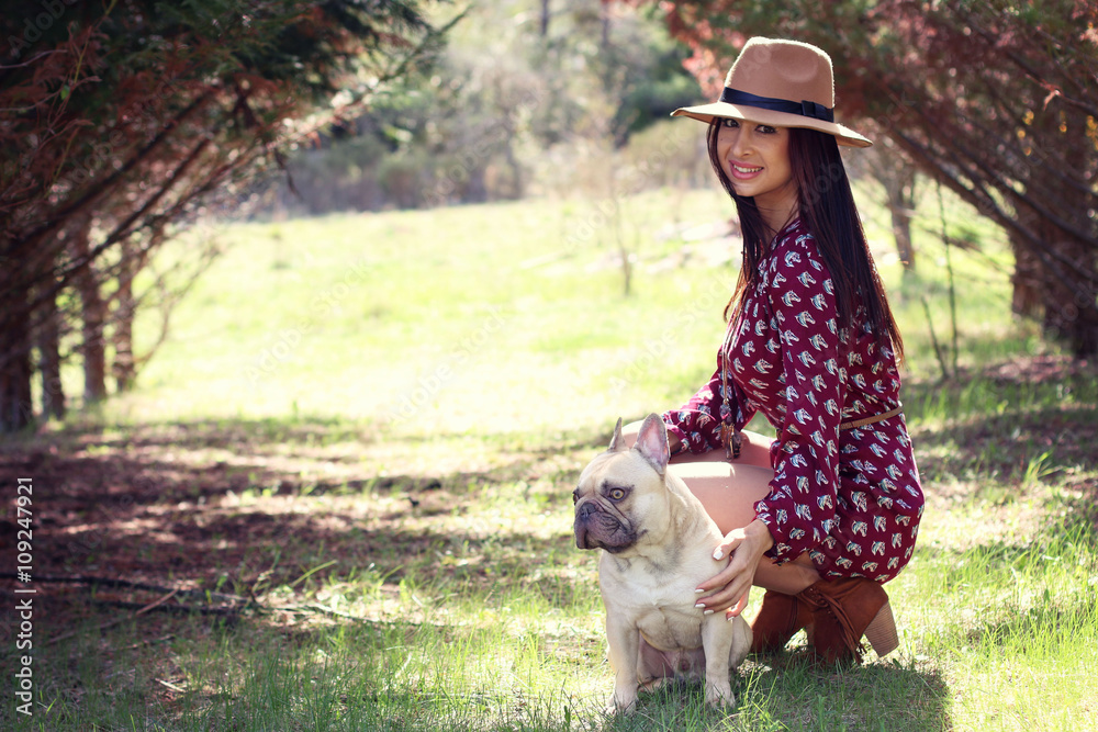 Beautiful woman sitting with her french bulldog Beautiful woman sitting with her french bulldog