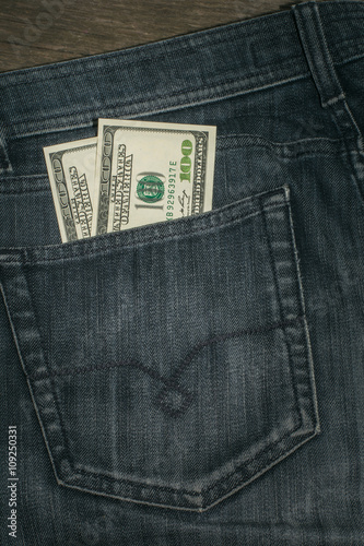 American Dollars in the Pocket of the Jeans. Сloseup.