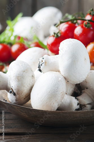 Concept of healthy food with champignon and tomato