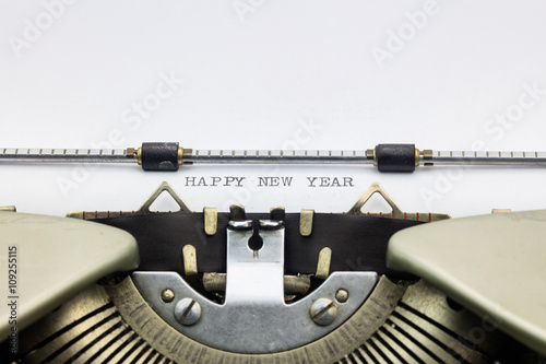 Happy New Year words in capital letters on white sheet