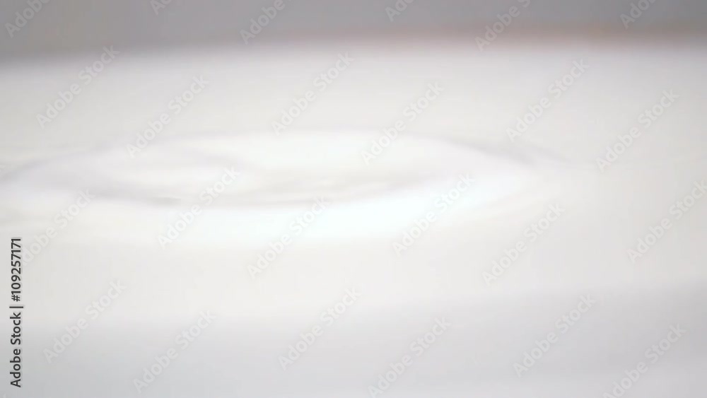 Berries of grape drop into the fresh white milk in slow motion. Shot on high-speed camera Sony RX 10 m2. Isolated Berries of grape drop into the fresh white milk in slow motion. Shot on high-speed camera Sony RX 10 m2. Isolated