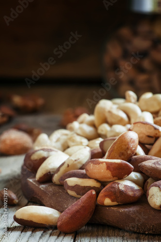Brazilian nut, nut mix, vintage wooden background, selective foc