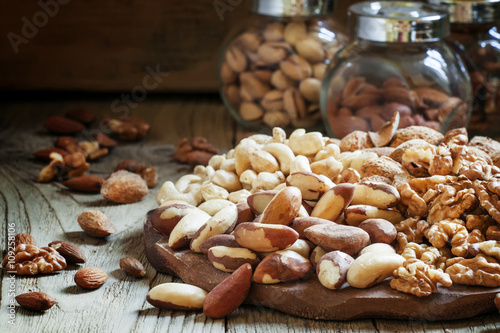 Brazilian nut, nut mix, vintage wooden background, selective foc photo