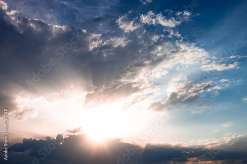 Cloudscape with sun and clouds