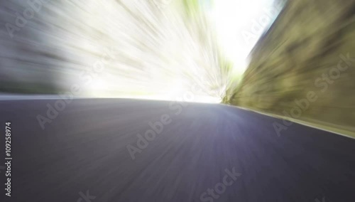 POV car driving down a mountain road in time lapse