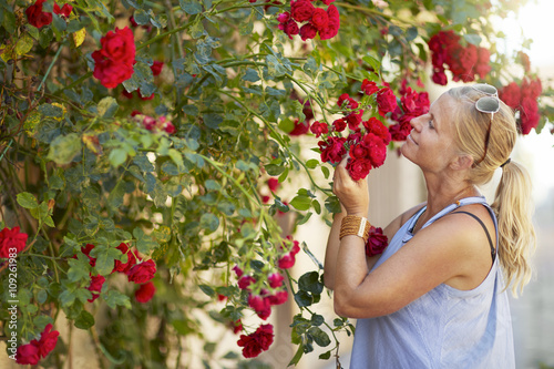 Woman smelling rose