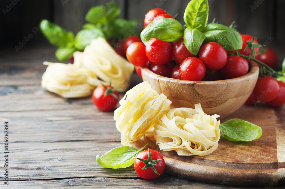 Concept of italian food with pasta and tomato Concept of italian food with pasta and tomato