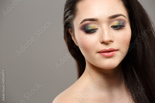 Portrait close up of young beautiful woman in studio