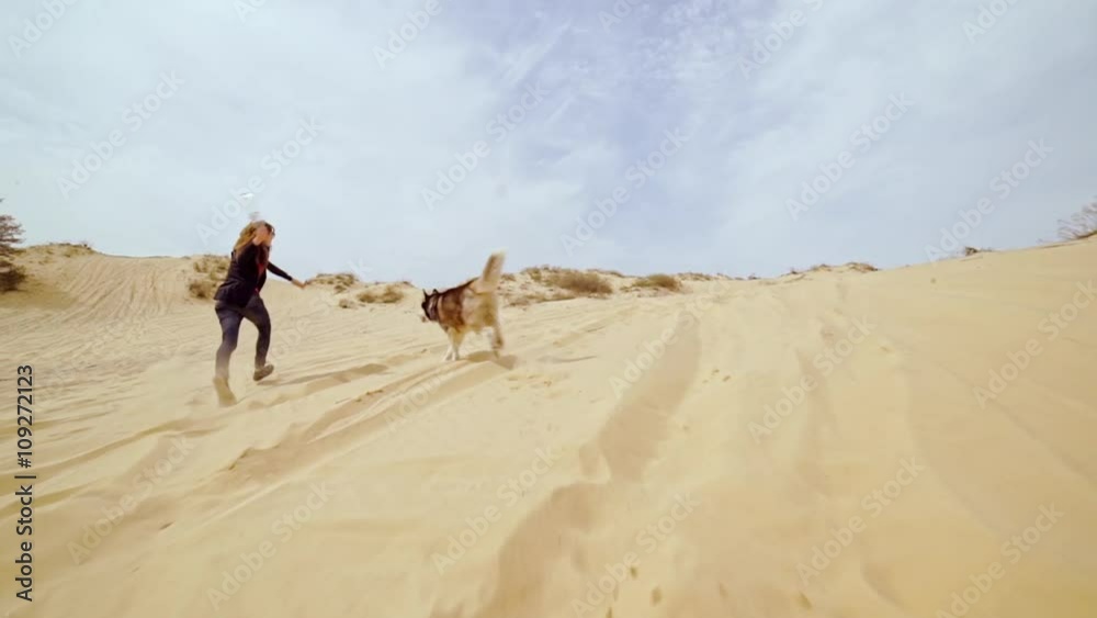 Family spending time together and having fun in Oleshky sands.Ukraine. Slow motion