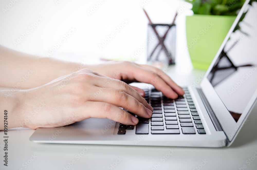 Man working with modern laptop in office