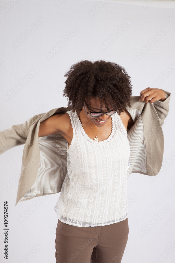 Happy woman putting her jacket on Stock Photo | Adobe Stock