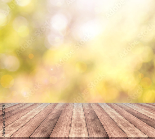 Wood table top and autumn bokeh background -  used for display your products