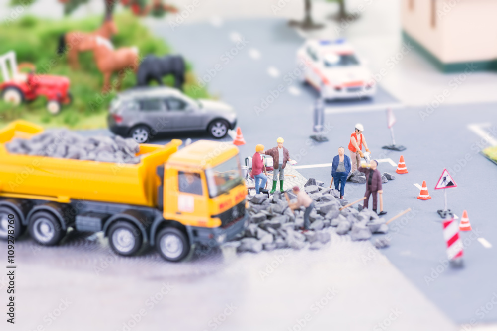 Road works with miniature workers 