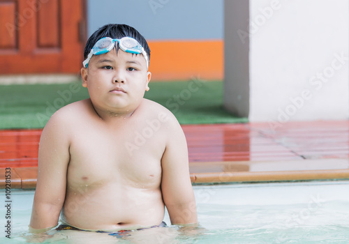 fat boy bored to swimming lesson © kwanchaichaiudom