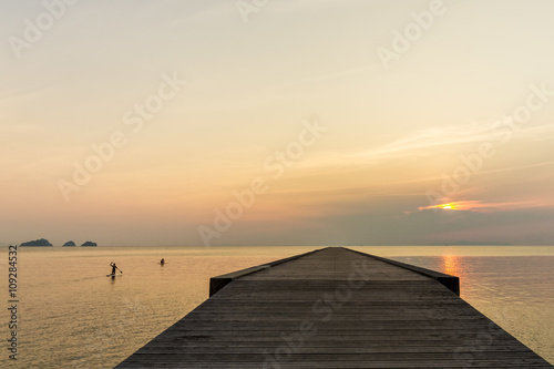 Fototapeta Naklejka Na Ścianę i Meble -  Sunset over pier and sea on a tropical island Koh Samui, Thailand