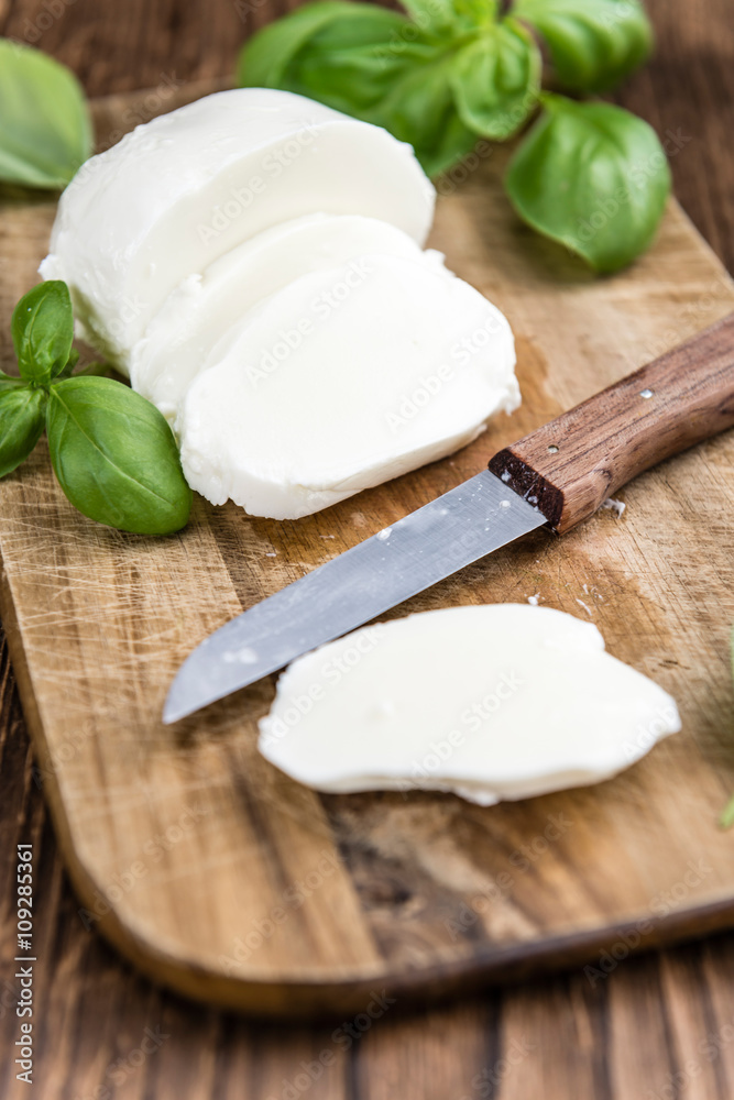 Portion of fresh Mozzarella (close-up shot) Portion of fresh Mozzarella (close-up shot)