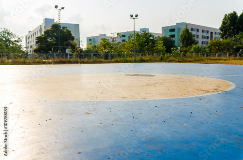 Futsal ball on dirty concrete field