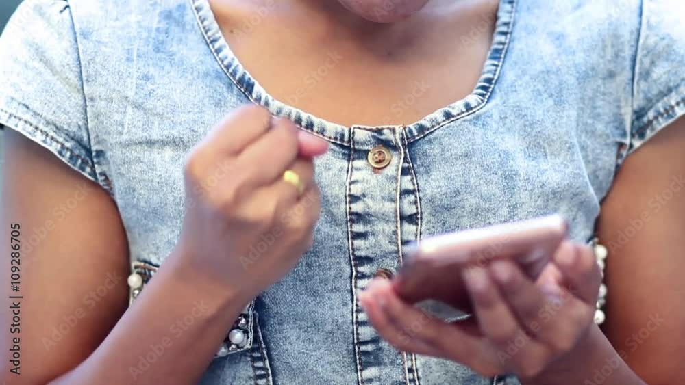 woman watching screen mobile phone and gesturing success