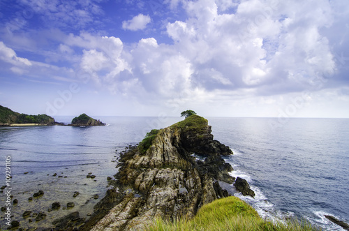 amazing seascape view from cliff top at Kapas Island, Terengganu, Malaysia. Cloudy and blue sky background. photo