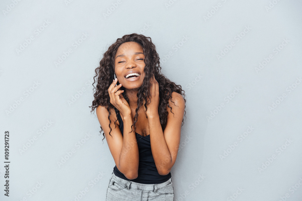 Laughing woman talking on the phone Laughing woman talking on the phone