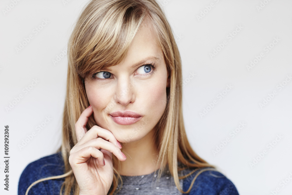 Blue eyed beautiful woman looking thoughtful Blue eyed beautiful woman looking thoughtful