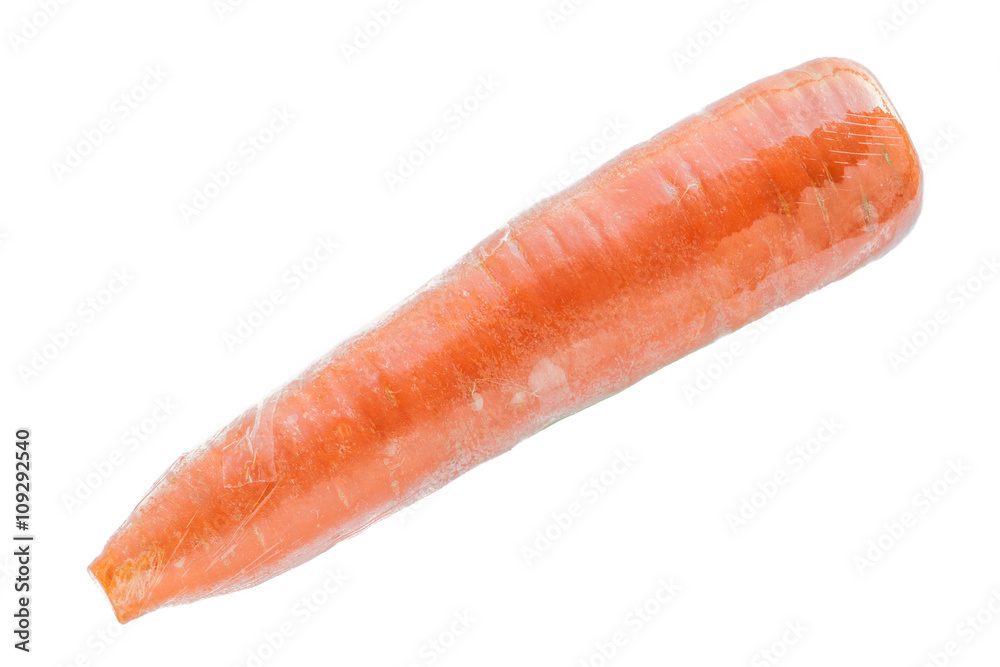 A carrot in plastic wrap isolated on white background. A carrot in plastic wrap isolated on white background.