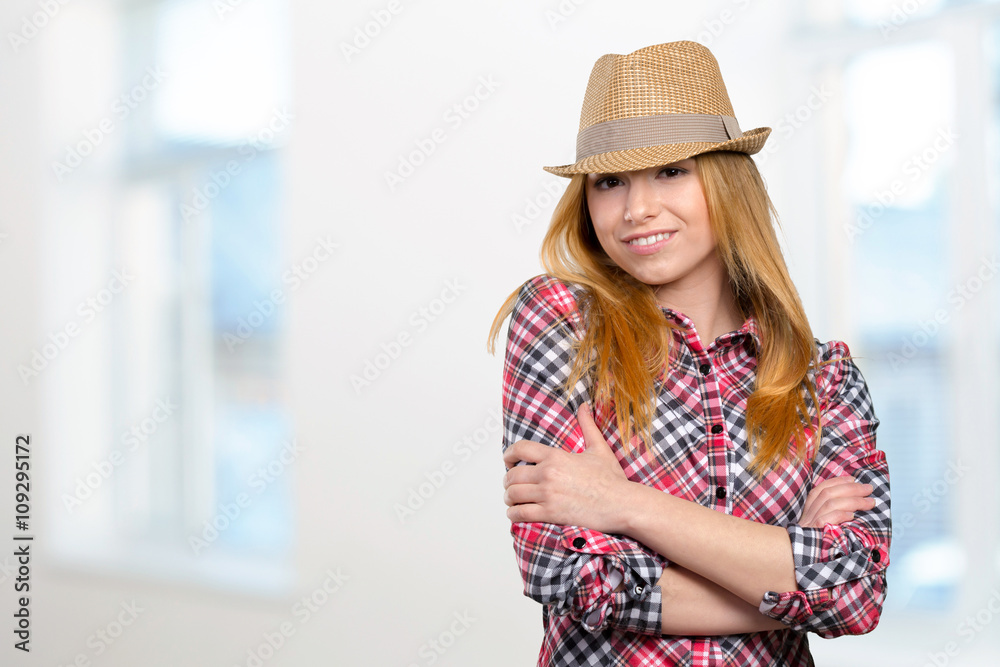 Slim pretty young girl in straw hat