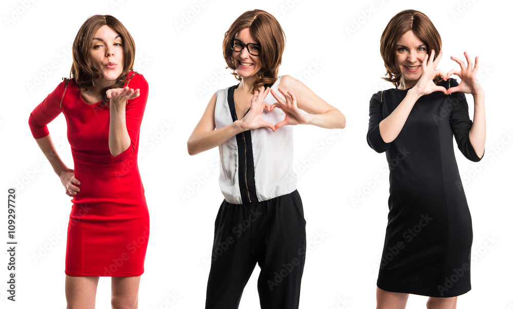 Fototapeta premium Brunette woman making a heart with her hands