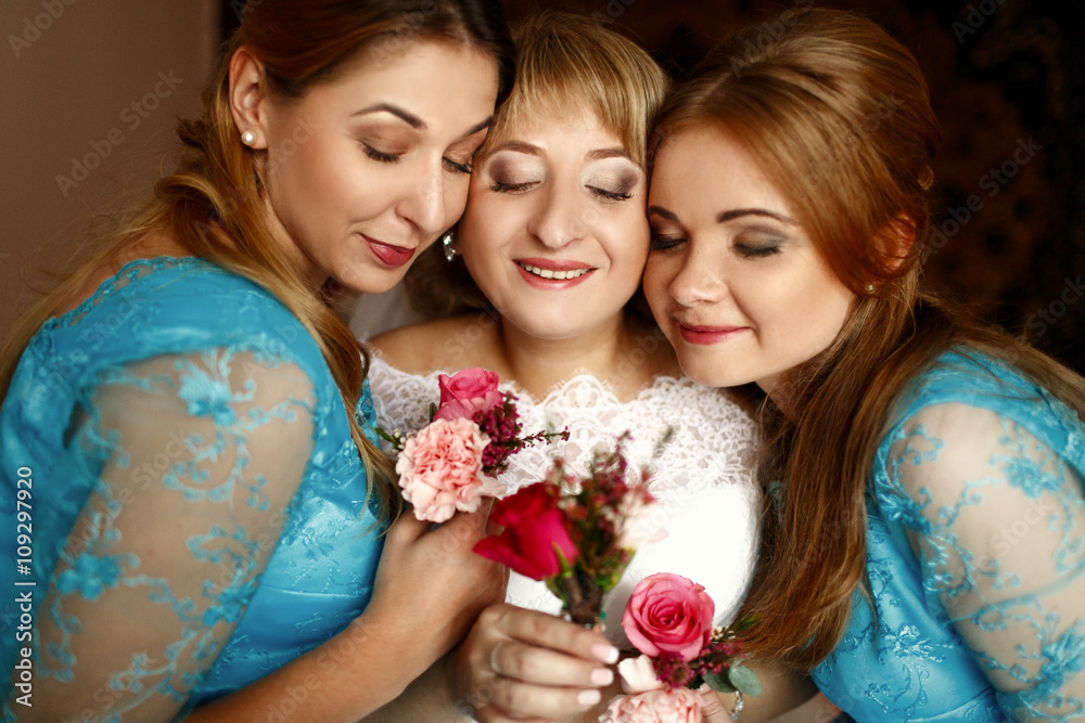 Happy beautiful bride with bridesmaids
