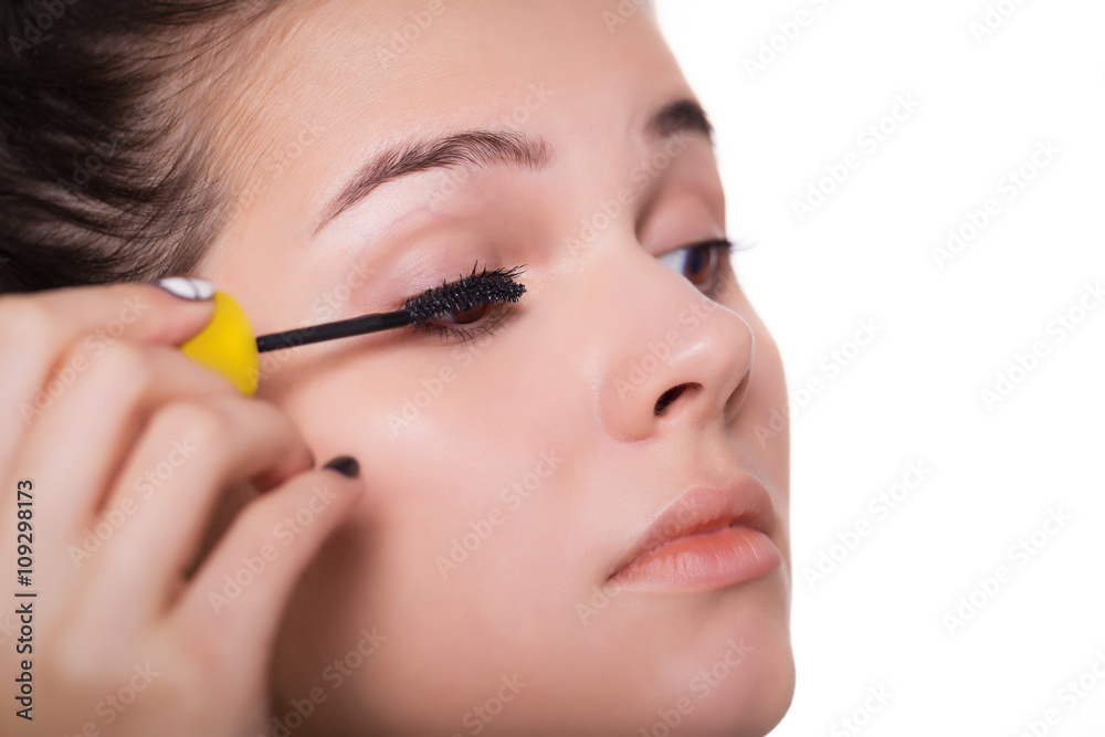 Young woman applying mascara - Makeup make-up