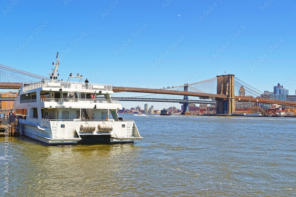 Ferry and Brooklyn bridge across East River