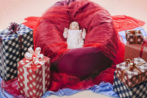 Colorful gift boxes with beautiful baby © Sergey Bogdanov
