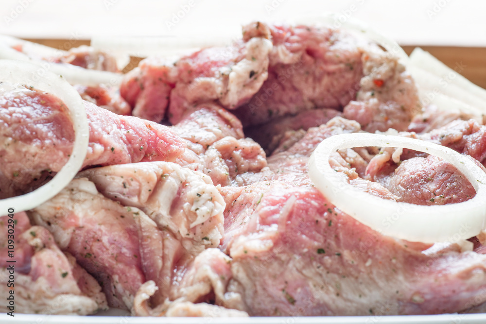 Fresh raw pork fillet steak  meat with sliced onion